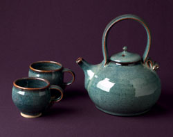 Photo of a teapot with two cups